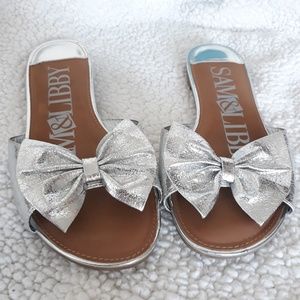 Silver slip-on sandals w/ bows